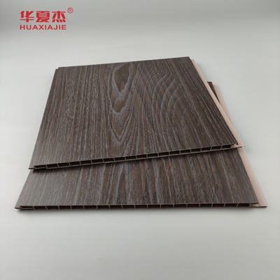 Vente en gros de panneaux muraux en Pvc à grain de bois foncé résistant à l'humidité Panneaux de plafond en Pvc Décoration de bureau