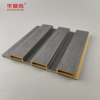 Nouveau produit Panneau mural Wpc à flûte Panneaux muraux Wpc à grains de bois stratifiés Installez facilement la décoration murale intérieure