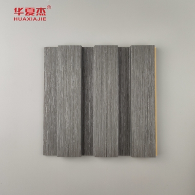 Nouveau produit Panneau mural Wpc à flûte Panneaux muraux Wpc à grains de bois stratifiés Installez facilement la décoration murale intérieure