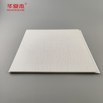 Ventes d'usine panneaux muraux en PVC intérieurs estampage à chaud grains de bois PVC plafond matériaux de construction imperméables à l'humidité